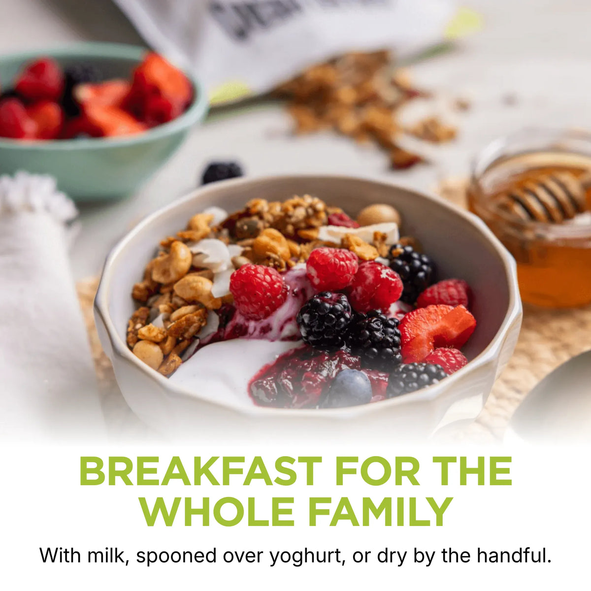 Paleo Hero Primal Muesli with yoghurt and berries, showing breakfast and snack serving suggestions.